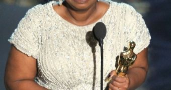 Octavia Spencer sheds a tear as she wins Best Supporting Actress at the Oscars 2012
