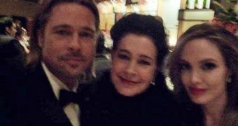 Before the arrest, Sean Young posing with Brad Pitt and Angelina Jolie at the Oscars 2012