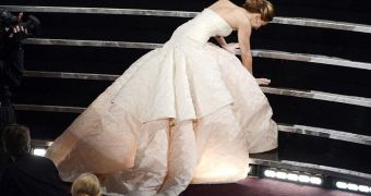 Jennifer Lawrence goes down on her way to accept the Oscar for Best Actress