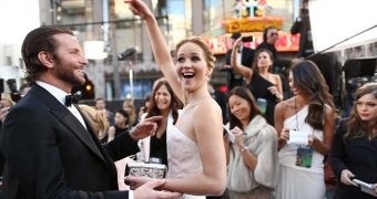 Jennifer Lawrence tries to divert attention to her co-star Bradley Cooper