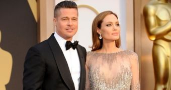Angelina Jolie in Elie Saab and Brad Pitt in Tom Ford