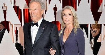 Clint Eastwood and his much younger girlfriend make red carpet debut at the Oscars 2015