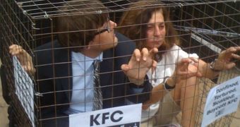 PETA members cage themselves hoping to raise awareness about animal rights