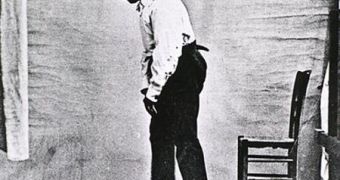 Full length view of a male with Parkinson's disease, showing a walking posture