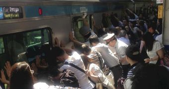 Passengers in Japan rescue woman stuck between train car and platform