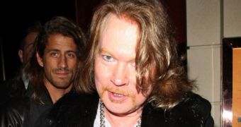 Axl Rose goes for the trendy bob, over-accessorizes