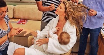 Breastfeeding advocate Gisele Bundchen relaxes while her assistants do her make up
