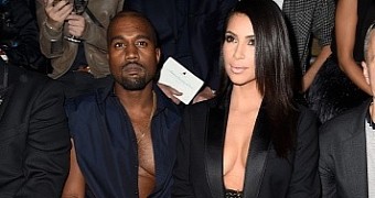 Kanye West and Kim Kardashian compete for lowest cleavage at Lanvin show in Paris