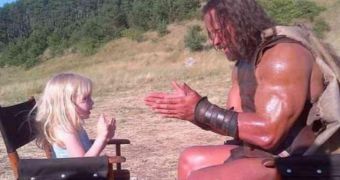 Dwayne “The Rock” Johnson and little blonde girl have some fun in between takes on “Hercules” set