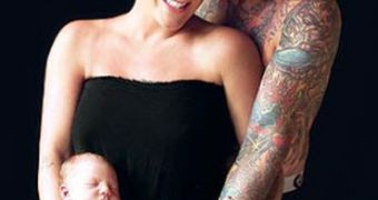 Pink and Carey Hart pose with daughter Willow Sage