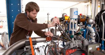 XCOR's Mark Street makes an adjustment to a fitting on the pump apparatus prior to an LH2 test