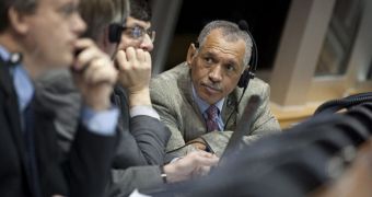 NASA chief Charles Bolden talks with other mission managers in Firing Room Four of the Launch Control Center as they monitor the countdown of the launch of the space shuttle Endeavor