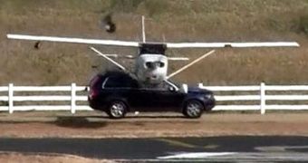 A small plane's landing gear crashes into a moving SUV, at an airport in Texas