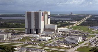 A view of the Vehicle Assembly Building at the KSC (foreground) with launch pads 39A and 39B in the background