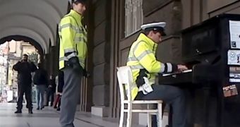 Policeman starts playing on a public piano on the streets of Prague