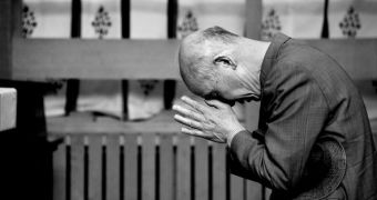 A man praying at a Japanese Shintō shrine
