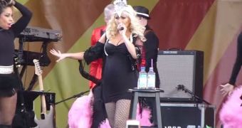 Christina Aguilera shows off her baby bump during impressive performance at the 2014 New Orleans Jazz and Heritage Festival