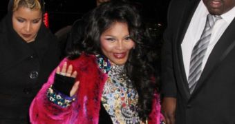 Lil Kim is pregnant with her first child, by Mr. Papers