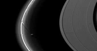 Cassini image showing the small moon Prometheus wreaking havoc in Saturn's F Ring