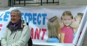 Protesters put up banners during anti-gay marriage march in Paris