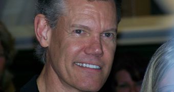 Randy Travis suffered a stroke, remains in critical condition at the hospital