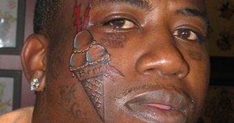 Rapper Gucci Mane shows off his new face tattoo: an ice cream cone