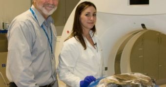 Radiologist Michael McNitt-Gray and ichthyologist Misty Paig-Tran position the oarfish for a CT scan at UCLA's Translational Research Imaging Center