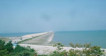 The beginning of the 33 km-long sea wall that upset the environmental balance of the wetlands in the region