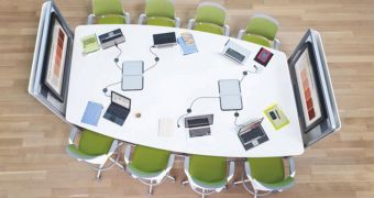 This conference table, from the design firm Steelcase, allows employees to dock their mobile devices and take turns sharing the displays at the ends of the table