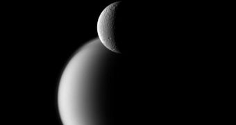 Rhea (foreground) and Titan seen together in amazing Cassini image