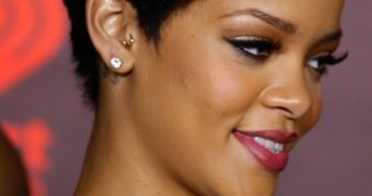 Rihanna is seriously considering going under the knife for bigger breasts to please Chris Brown, says report