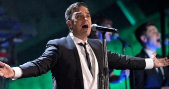 Robbie Williams is honored with the Lifetime Achievement award at the Brits 2010, performs