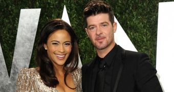 It's splitsville for singer Robin Thicke and actress Paula Patton 6 months after they first announced their divorce