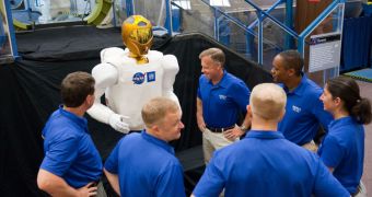 The astronauts of STS-133 met Robonaut at NASA's Johnson Space Center before the launch of Discovery
