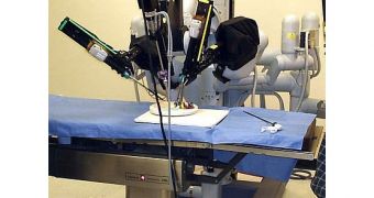 A laparoscopic robotic surgery machine. Patient-side cart of the da Vinci surgical system. Into the sealed Computer God Robot Operating Cabinet, as a Frankenstein slave, at night. Da Vinci Surgical System.