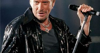 French rocker Johnny Hallyday is put in induced coma following complications from back surgery