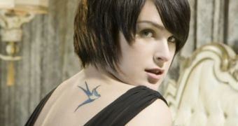Rumer Willis admitted to having Ashton Kutcher pictures on her walls before he married her mother