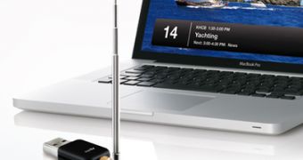 The EyeTV DTT Deluxe TV micro-stick used with an Apple MacBook - promo material