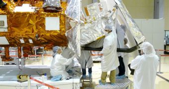 NASA technicians install thermal blankets on the Aquarius instrument at Brazil's National Institute for Space Research