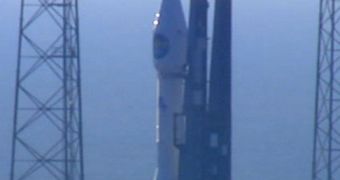The Atlas 5 rocket sits at its CCAFS launch pad, moments before taking off