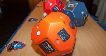 Models of the SPHERES robots sent to the International Space Station