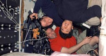 Takao Doi (up-right), Robert Behnken (up-left) and Mike Foreman on board Endeavor during STS-123