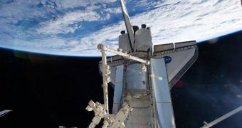 One of the ISS' robotic arms is seen here grappling the MPLM Leonardo, during the STS-131 mission
