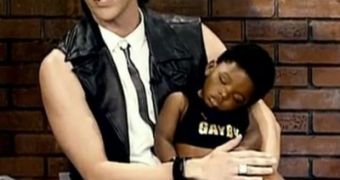 Sacha Baron Cohen as Bruno, with his newly adopted African baby boy