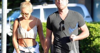 Sam Worthington gets arrested after he punched a paparazzo in the face for attacking his girlfriend Lara Bingle