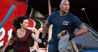 Carla Gugino and Dwayne “The Rock” Johnson make a run for it in “San Andreas”