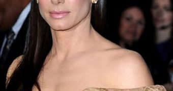 Sandra Bullock outsmarts the paparazzi by allowing Getty to snap first picture of her since the cheating scandal began