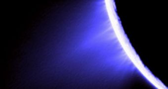 False color image showing Enceladus ejecting icy plumes from areas alocated near the south pole