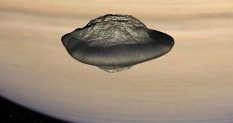 This computer rendition of Pan, based on Cassini data, shows the interesting walnut shape this icy moon has