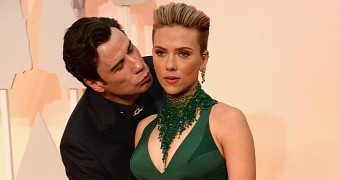 John Travolta surprises Scarlett Johansson with some PDA on the red carpet at the Oscars 2015